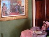 Picture of student observing a painting at Sudley Art Gallery